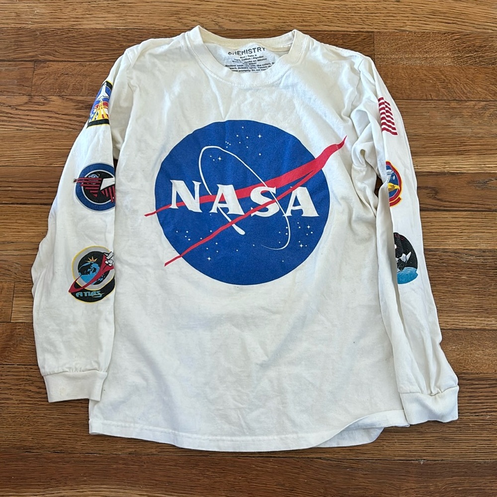 White NASA long sleeve with graphics down both sleeves